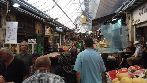 Jerusalem, Israel - July 2, 2019: people shopping at Mahane Yehuda market, 4k POV real time video footage