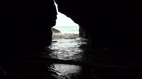The tidal waves wash into a cave