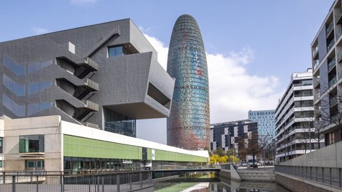 BARCELONA - MARCH 2021 - Timelapse of the museo del deseno and surrounduing towers and skyscrapers of the barcelona city skyline, spain