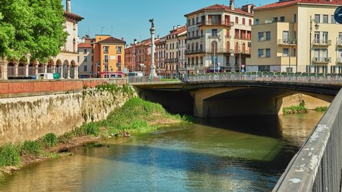 VICENZA, ITALY - APRIL 22 2018: Bridge of Angels and Square XX September with winged angel on Bacchiglione River in historic center of Vicenza, Italy.
