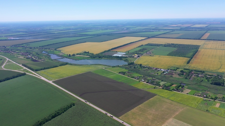 Panoramic view of a rural settlement in the fields, motorway from the rightPanoramic view of a rural settlement in the fields, motorway from the right