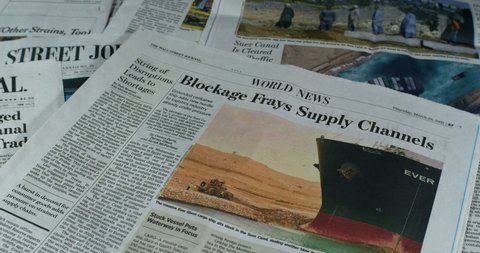 New York, New York  United States - March 23,  2021: Newspaper coverage of Suez Canal Blocked After Giant Container Ship, "Ever Given"  Gets Stuck.
