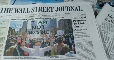 New York, New York  United States - March 25,  2021: Newspaper coverage of Protesters Rally Against Anti-Asian Hate, N.Y.C. Records 5 Attacks.