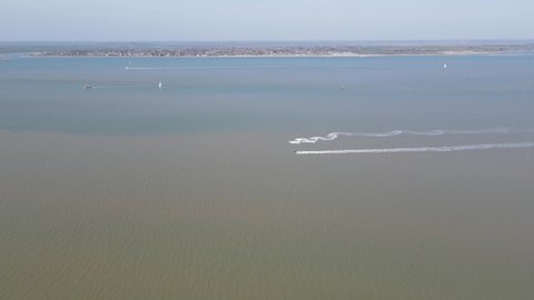 River Blackwater Estuary Jet ski's West Mersea Essex UK Aerial footage 4K