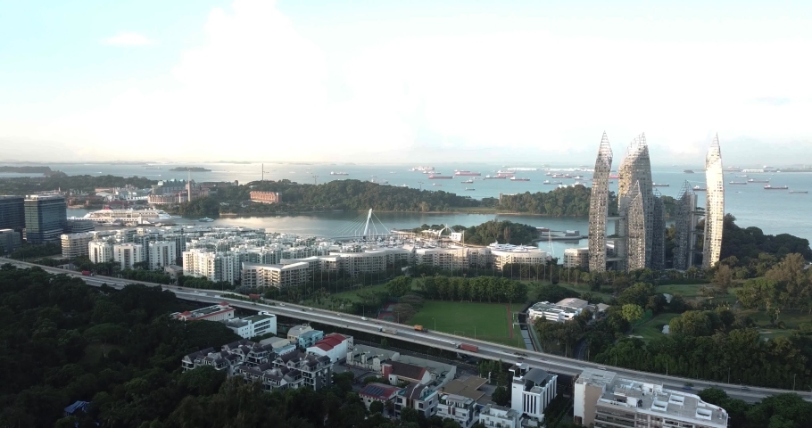 Drone Aerial View of Highway Traffic by Keppel Bay, Singapore. Modern Cityscape on Evening