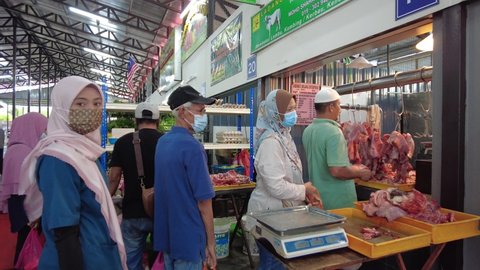 Seremban, Malaysia - 12th April 2021 : Local muslims di Ampangan buying meats and chickens during Hari Mantai also known as Mantai day, in preparation for fasting month of Ramadhan