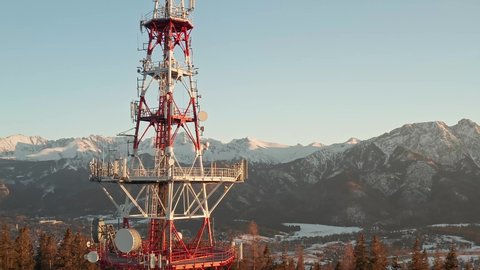Zakopane-Gubalowka Transmitter Tower With Snowy Mountain In Background At Zakopane, Poland. - aerial