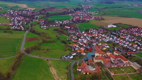 Aerial view of the village and monastery Johannesberg in Germany, Hesse on an early spring day.
