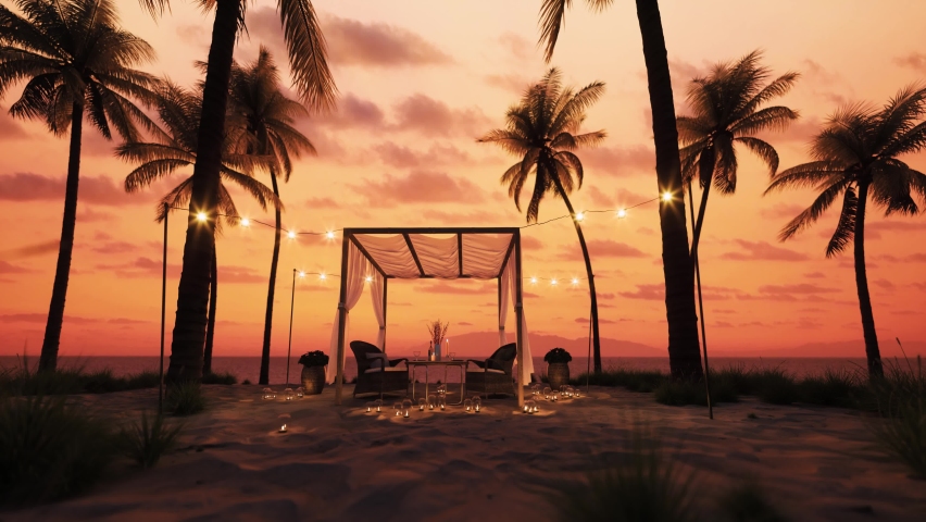 Table under canopy on the beach. Silhouette of beach cafe. Romantic dinner on the beach. Romantic sunset on the beach under palm trees