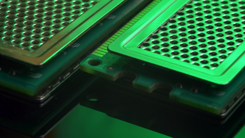DDR RAM sticks on green light mirror background. Double Data Rate Random Access Memory. Computer memory module with contact pins. Heat spreader Royalty-Free Stock Footage #1070563807