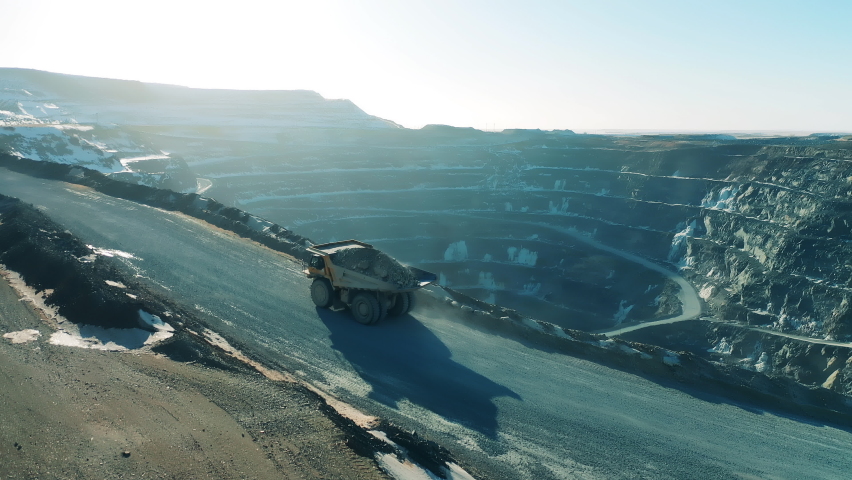 Loaded truck is riding along the copper mine deposit Royalty-Free Stock Footage #1070565490