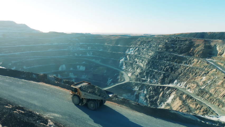 Loaded truck is riding along the copper mine deposit | Shutterstock HD Video #1070565490