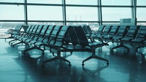 Airport lounge with seats marked for social distancing - Powered by Shutterstock - Get 15% off with code: PIKWIZARD15