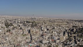 Aerial view Amman Jordan. Drone video of the capital of the Arab country. Sandstone houses on the slopes of the mountains in the desert in the Middle East.