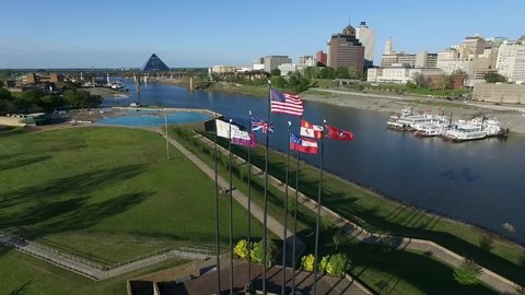 Waving Flags in Mud Island River Park, Memphis, Tennessee. Hernando de Soto Bridge and Mississippi River in Background