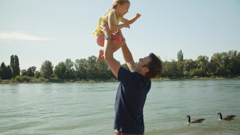 Father playing with his Daugther at the Rhine River, Happy Family 