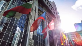 Flags of various European countries waving in front of Parliament building, Brussels 4K - Powered by Shutterstock - Get 15% off with code: PIKWIZARD15