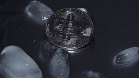 bitcoin on a black background in the rain - Powered by Shutterstock - Get 15% off with code: PIKWIZARD15