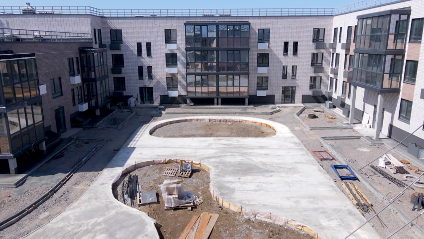 Construction of modern residential buildings. View from above. Improvement of the adjoining territory in the kleb house. New real estate.
