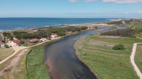 DRONE AERIAL FOOTAGE: The mouth and estuary of Neiva River in Castelo do Neiva, Viana do Castelo, Portugal. 