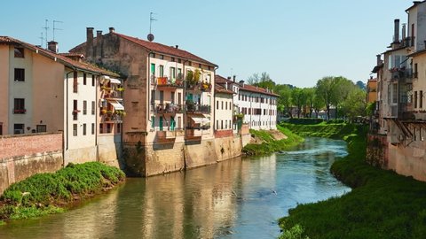 VICENZA, ITALY - APRIL 22 2018: Bacchiglione River in historic center of Vicenza, Italy.