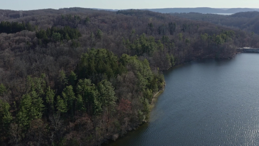 Forest on banks of New Croton dam, Ney York. Aerial circling