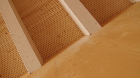 Detail of a wooden wall with a wooden roof in a new residential building construction