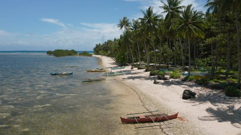 Aerial showing wooden fishing boats on Union Beach, Siargao Island, Philippines.