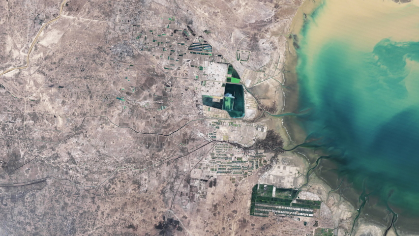 Urbanization and city growth time lapse aerial satellite view animation, environmental issues concept on yellow river delta, China. Contains images furnished by Nasa