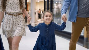 Video of happy little girl during shopping at the mall. Shot with RED helium camera in 8K.