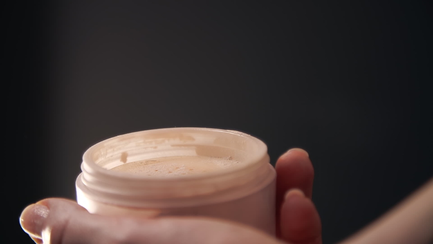 Makeup artist collects cosmetics from a box. Close-up of female hands mixing face powder. High quality FullHD footage Royalty-Free Stock Footage #1070653546