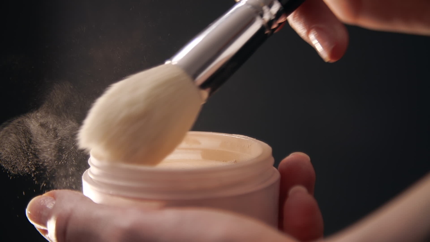 Makeup artist collects cosmetics from a box. Close-up of female hands mixing face powder. High quality FullHD footage | Shutterstock HD Video #1070653546
