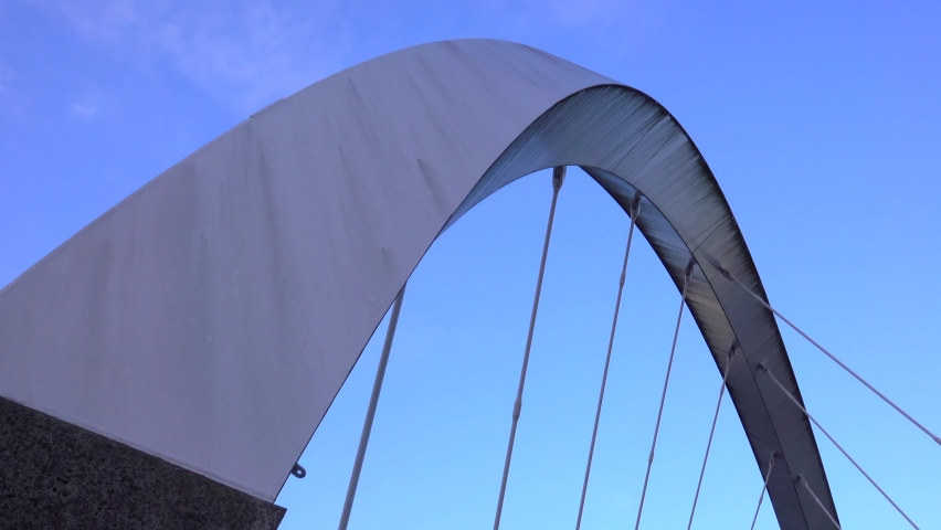 Abstract Architecture Tilt Reveal Shot Of A Modern Curving Suspension Bridge - Powered by Shutterstock - Get 15% off with code: PIKWIZARD15