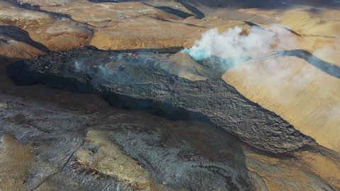 From above magma sparks out of the volcano hole in Iceland