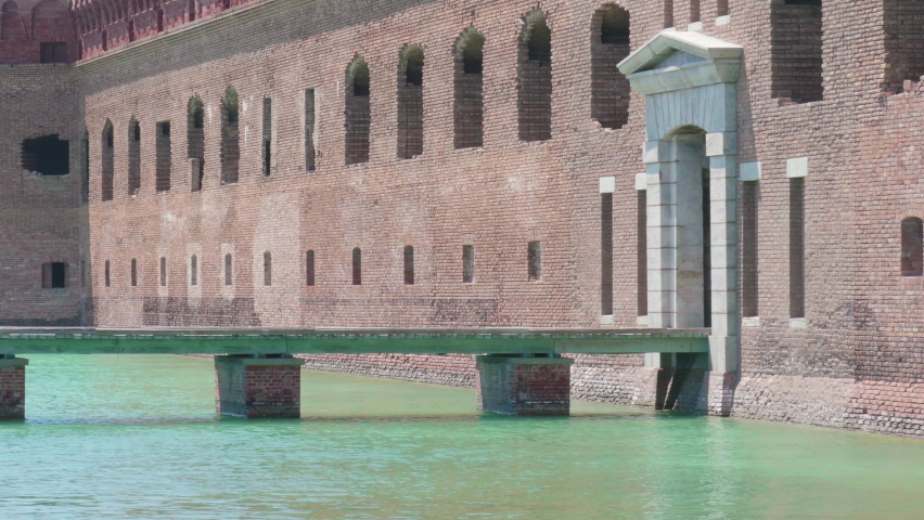 The entrance with the walkway bridge going over the mote area of Fort Jefferson, part of Dry Tortugas National Park in the Florida Keys, 70 miles off the western coast of Key West.