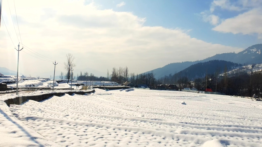 snow white andscape in kashmir, kashmir looks beautiful during white fresh snow. Winter games in Gulmarg sonmarg pahalgam starts, snow cap hills trees roads looks white and cool