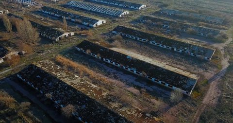 Aerial view of ruined buildings of cow farm in countryside, Ukraine.