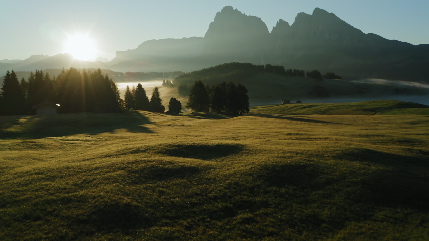 Alpe di Suisi, Dolomites. Aerial drone view of Alpine meadow mountain Plateau in Italy. Sunrise morning landcape scenary at idyllic Seiser Alm valley in South Tyrol. Europe Royalty-Free Stock Footage #1070679283
