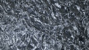 Background from foil of silver color is shimmering of bright lights. Macro. Closeup - Powered by Shutterstock - Get 15% off with code: PIKWIZARD15