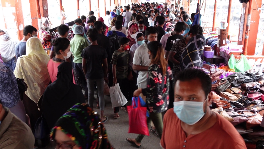 Bangladesh u2013 april 12, 2021: in the coronavirus epidemic time without  following the hygiene rules the most city peoples are being busy shopping  for the upcoming eid at dhaka new market.