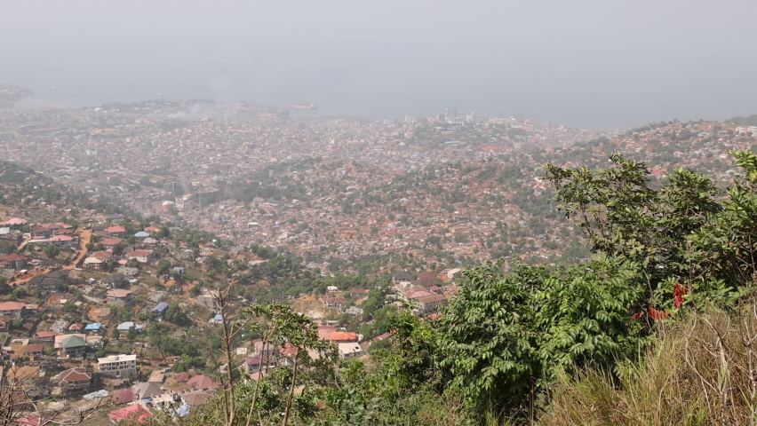 Freetown Sierra Leone mountain to ocean urban city. Coast of west Africa extreme poverty and hunger. Capitol Embassy locations. Tropical climate environment.