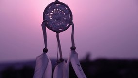 Dreamcatcher with white feather thread and beaded string. Handmade Dreamcatcher.The light of the setting sun.Soft focus.                                           - Powered by Shutterstock - Get 15% off with code: PIKWIZARD15