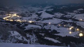Night village in winter time lapse in Carpatian mountains, timelapse, UHD 8K video