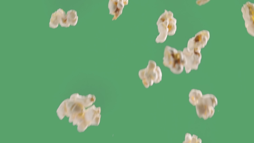Popping Popcorn Flying and Falling Isolated on ChromaKey Background