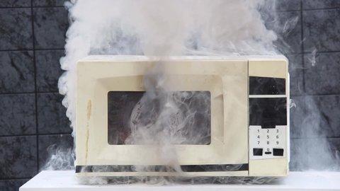 Microwave oven caught fire and caused domestic fire.