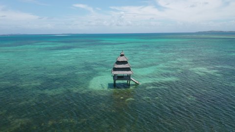 Aerial showing fisherrman house on stilts in the sea nearby General Luna on Siargao Island, Philippines.