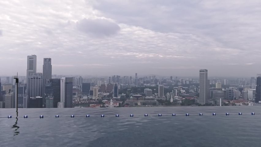 Stunning Infinity Pool at Marina Bay Sands Hotel SkyPark, Singapore - Wide static shot Royalty-Free Stock Footage #1070756071
