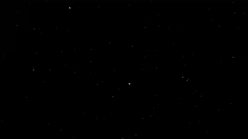 White dust particles glimmering on black background. Beautiful easy to use as an overlay on your footage.