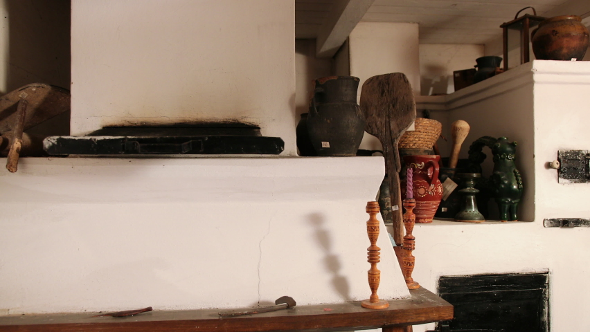 Interior of an old ukrainian room of the 19th century with a stove and personal household items