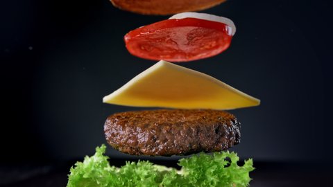 Beef Burger Ingredients Falling and Landing in the Bun One by One in Slow Motion 1000fps